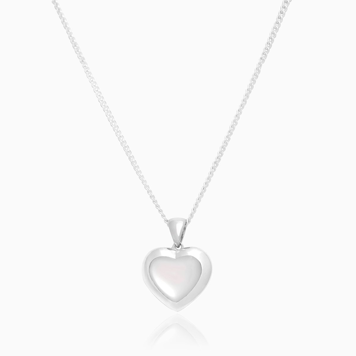  Front shot of a petite heart-shaped sterling silver locket set with white mother of pearl on a sterling silver curb chain.