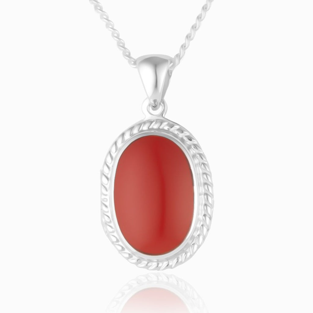 Sterling silver 925 oval locket with coral stone setting.