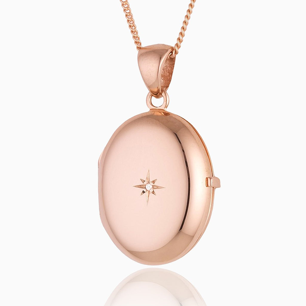 9 ct rose gold 4-photo oval locket set with a diamond on a 9 ct rose gold curb chain