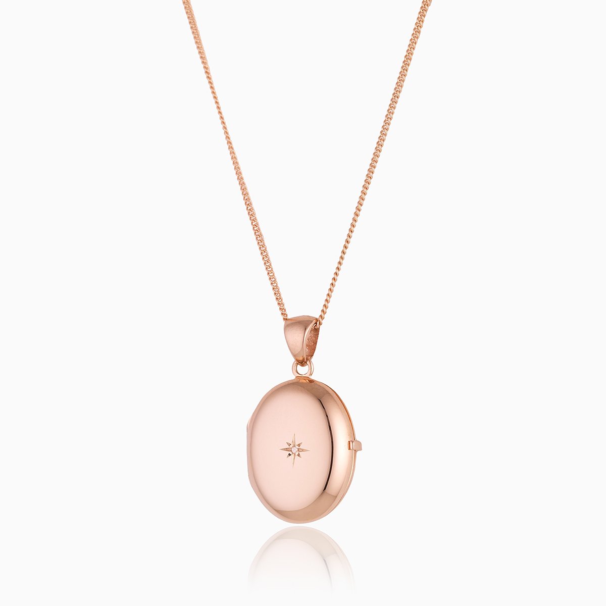 9 ct rose gold 4-photo oval locket set with a diamond on a 9 ct rose gold curb chain