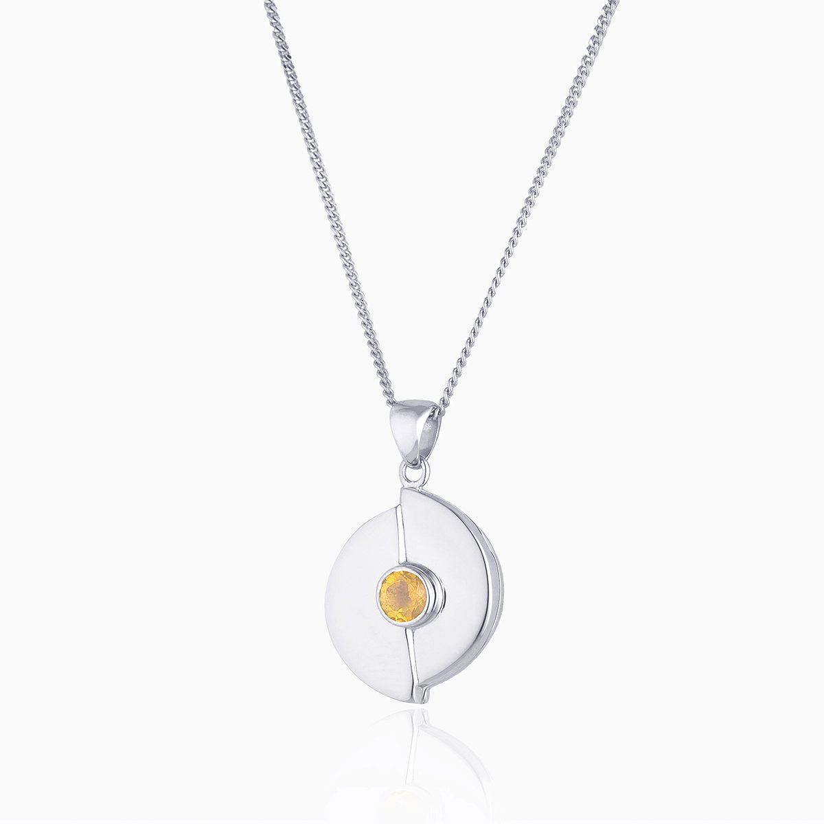 Circular 9 ct white gold locket set with a yellow citrine on a 9 ct white gold curb chain