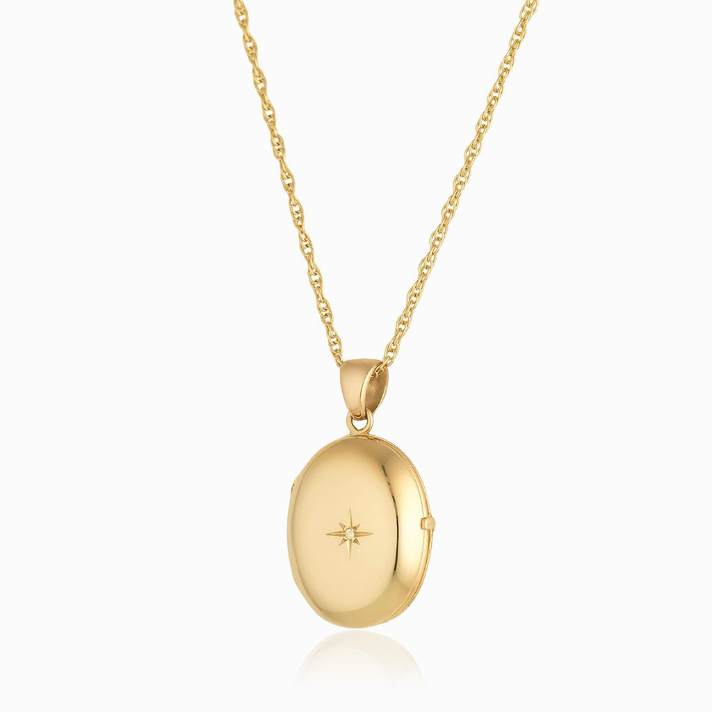 9 ct gold 4-photo oval locket set with a diamond on a 9 ct gold rope chain