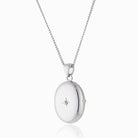 Product title: Dainty Silver and Topaz 4-Photo Locket, product type: Locket